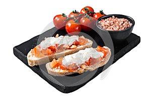 Ciabatta toasts with stracciatella cheese, chopped tomatoes and basil. Isolated on white background. Top view.