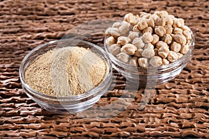 Cicer arietinum - Organic chickpea flour. Wood background