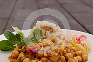 Cicer with vegetables and rice on a table