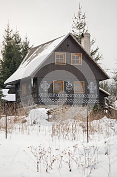 Cicmany, Slovakia. Old wooden houses in Slovakia village Cicmany in winter. The ornaments from Cicmany, and the Slovak folk patter