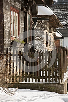 Cicmany, Slovakia. Old wooden houses in Slovakia village Cicmany in winter. The ornaments from Cicmany, and the Slovak folk patter