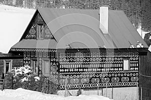 Cicmany, Slovakia. Old wooden houses in Slovakia village Cicmany in winter. The ornaments from Cicmany, and the Slovak folk patter