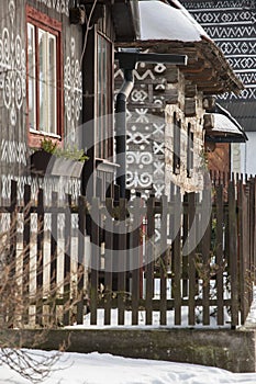 Cicmany, Slovakia. Old wooden houses in Slovakia village Cicmany in winter. The ornaments from Cicmany, and the Slovak folk patter