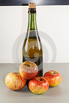 Cider bottle and apples