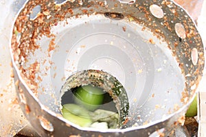 A cider mill, crushing apples into apple juice