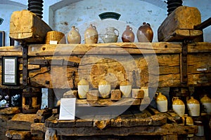 Cider press and old fashioned flagons Cornwall UK