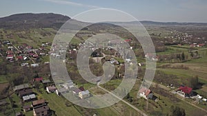 Cieklin, Poland - 4 9 2019: Panorama of a small European village with a Christian Catholic church in the center. Farms among green