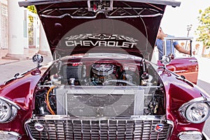 CIENFUEGOS, CUBA - MARCH 11, 2018 Red Chevrolet 350 fitfyfive - 1955 Chevy Nomad Restomod. View under the front bonnet on the engi