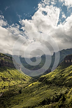 Ciffs and mountain sides under dramatic skies on the Thukela hike to the bottom of the Amphitheatre`s Tugela Falls photo