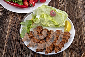 Cig kofte, a raw meat dish in Turkish and Armenian cuisines. Turkish cig means