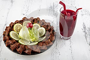 Cig kofte, a raw meat dish in Turkish and Armenian cuisines. Turkish cig means