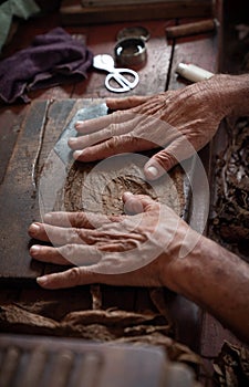 Cigar rolling or making by torcedor in cuba photo