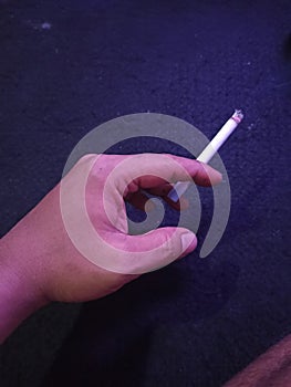 Cigaret in hand people photo