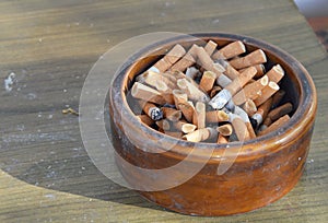 Cigarette filter in ceramic ashtray