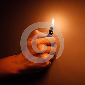 Cigarette lighter igniting by a hand