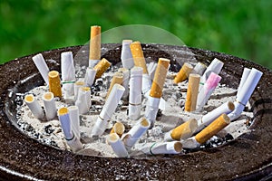 Cigarettes in ashtray photo