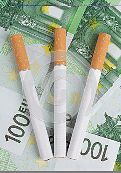 Cigarettes lying on the bills