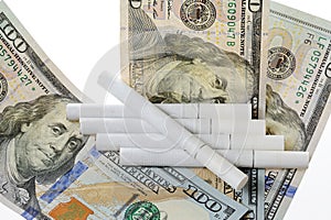 Cigarettes on top of dollars
