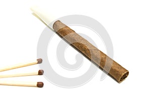 Cigarillo and three matches on white