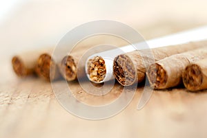 Cigarillo in a wood background