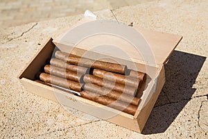 Cigars are in a box. Top view.