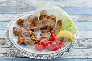 Cigkofte turkish meatball from bulgur with tomato, lemon