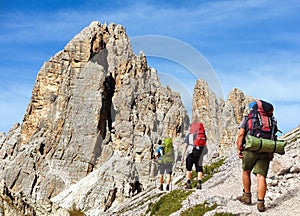 Cima Ambrizzola and Croda da Lago with three hikers