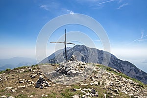 Cima delle Pozzette, wooden cross on the top of a mountain, hiking trail Alta Via del Monte Baldo photo