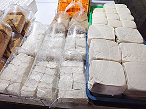 Cina tofu, susu tofu, and brown tofu at a table photo