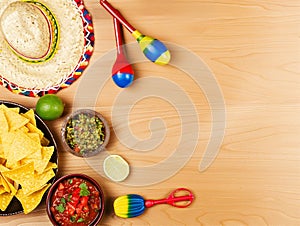 Cinco de Mayo holiday background. Cactus, hat and maracas