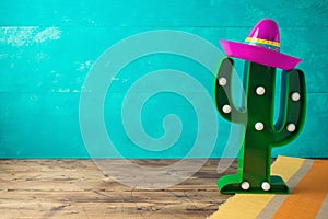Cinco de Mayo holiday background with Mexican cactus and  party sombrero hat photo