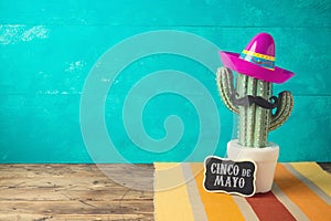 Cinco de Mayo holiday background with Mexican cactus and  party sombrero hat photo