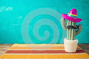 Cinco de Mayo holiday background with Mexican cactus and  party sombrero hat