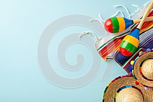 Cinco de Mayo theme with overhead shot of festive items: sombreros photo