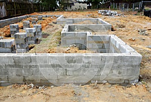 Cinder block foundation being built for new home construction