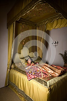 Cinderella on antique canopy bed