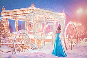 Cinderella near carriage going to dance. Fairy Tale