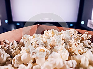 Cinema and entertainment, popcorn box in the movie theatre for tv show streaming service and film industry production