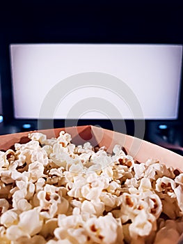 Cinema and entertainment, popcorn box in the movie theatre for tv show streaming service and film industry production