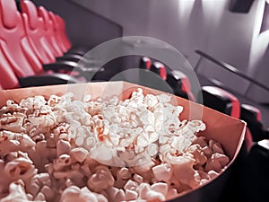 Cinema and entertainment, popcorn box in the movie theatre for tv show streaming service and film industry production