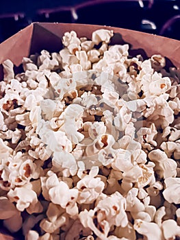 Cinema and entertainment, popcorn box in the movie theatre for tv show streaming service and film industry production