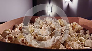 Cinema and entertainment, popcorn box in the movie theatre for tv show streaming service and film industry production