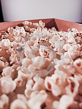 Cinema and entertainment, popcorn box in the movie theatre for tv show streaming service and film industry production