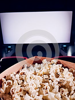 Cinema and entertainment, popcorn box in the movie theatre for tv show streaming service and film industry production