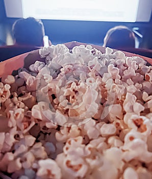 Cinema and entertainment, popcorn box in the movie theatre for tv show streaming service and film industry production