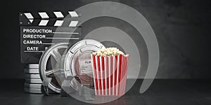 Cinema movie concept background. Film reel and tape, popcorn an