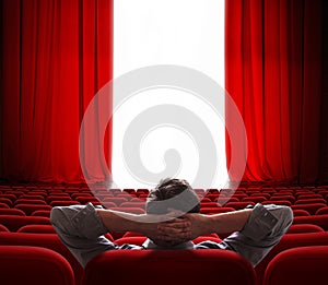 Cinema screen red curtains opening for vip person