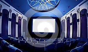 Cinema theater showing empty white movie screen