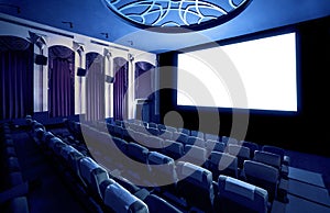 Cinema theater showing empty white movie screen