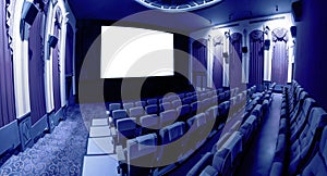 Cinema theater showing empty white movie screen